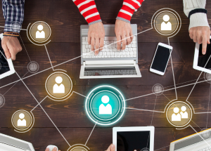 Hands using devices with a digital network connection overlay